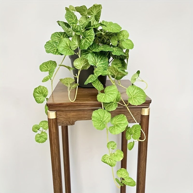 An artificial hanging vine pla - Pilea Peperomioides 评论和价格