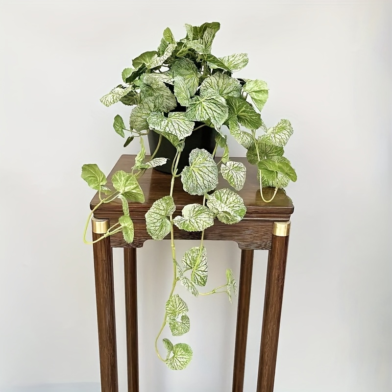 An artificial hanging vine pla - Pilea Peperomioides 评论和价格